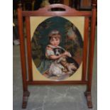 AN ANTIQUE WOODEN FIRESCREEN, inset embroidered panel depicting a young girl with her dog. 76 cm