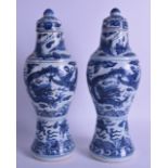 A GOOD PAIR OF CHINESE QING DYNASTY BLUE AND WHITE BALUSTER VASES AND COVERS possibly from a