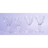 A SET OF THREE FRENCH BACCARAT GLASSES together with a smaller Baccarat glass. 14 cm & 12.5 cm high.