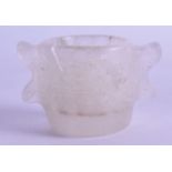 AN UNUSUAL ISLAMIC ROCK CRYSTAL TWIN HANDLED CUP decorated with script. 6.75 cm wide.