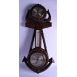 AN ANTIQUE H HUGHES & SON LTD OF LONDON OAK BAROMETER with silvered dials, in the form of an anchor.