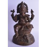 A LARGE INDIAN BRONZE FIGURE OF GANESHA modelled upon a triangular base. 35.5 cm high.