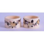 A PAIR OF 19TH CENTURY JAPANESE MEIJI PERIOD CARVED IVORY SHIBAYAMA NAPKIN RINGS decorated with