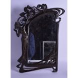 AN ART NOUVEAU SPELTER MIRROR in the manner of WMF, modelled as a classical female clutching at
