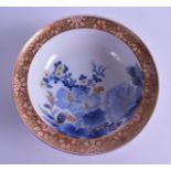 A 19TH CENTURY JAPANES MEIJI PERIOD IMARI PORCELAIN BOWL painted with flowers and gilt scrolls. 21