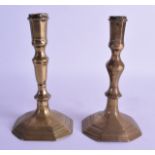 A PAIR OF 18TH CENTURY CONTINENTAL BRASS CANDLESTICKS upon an octagonal base. 19 cm high.