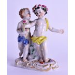 A 19TH CENTURY MEISSEN PORCELAIN FIGURE OF TWO FEMALES modelled upon a gilt painted base,