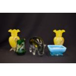 A PAIR OF YELLO OVERLAID GLASS VASES, together with a glass hippo and two glass items. (5)