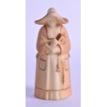 A ROYAL WORCESTER BLUSH IVORY CANDLE SNUFFER in the form of a nun. 10.5 cm high.