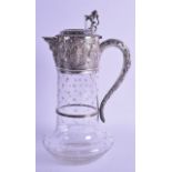 A VICTORIAN SILVER MOUNTED GLASS CLARET JUG by Robert Harper. With central bacchus mask head. London