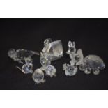 A GROUP OF NINE SWAROVSKI CRYSTAL FIGURINES, including a swan & a seal. (9)