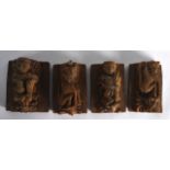 A GROUP OF FOUR 17TH/18TH CENTURY INDIAN CARVED WOODEN TEMPLE PANELS each carved with a figure