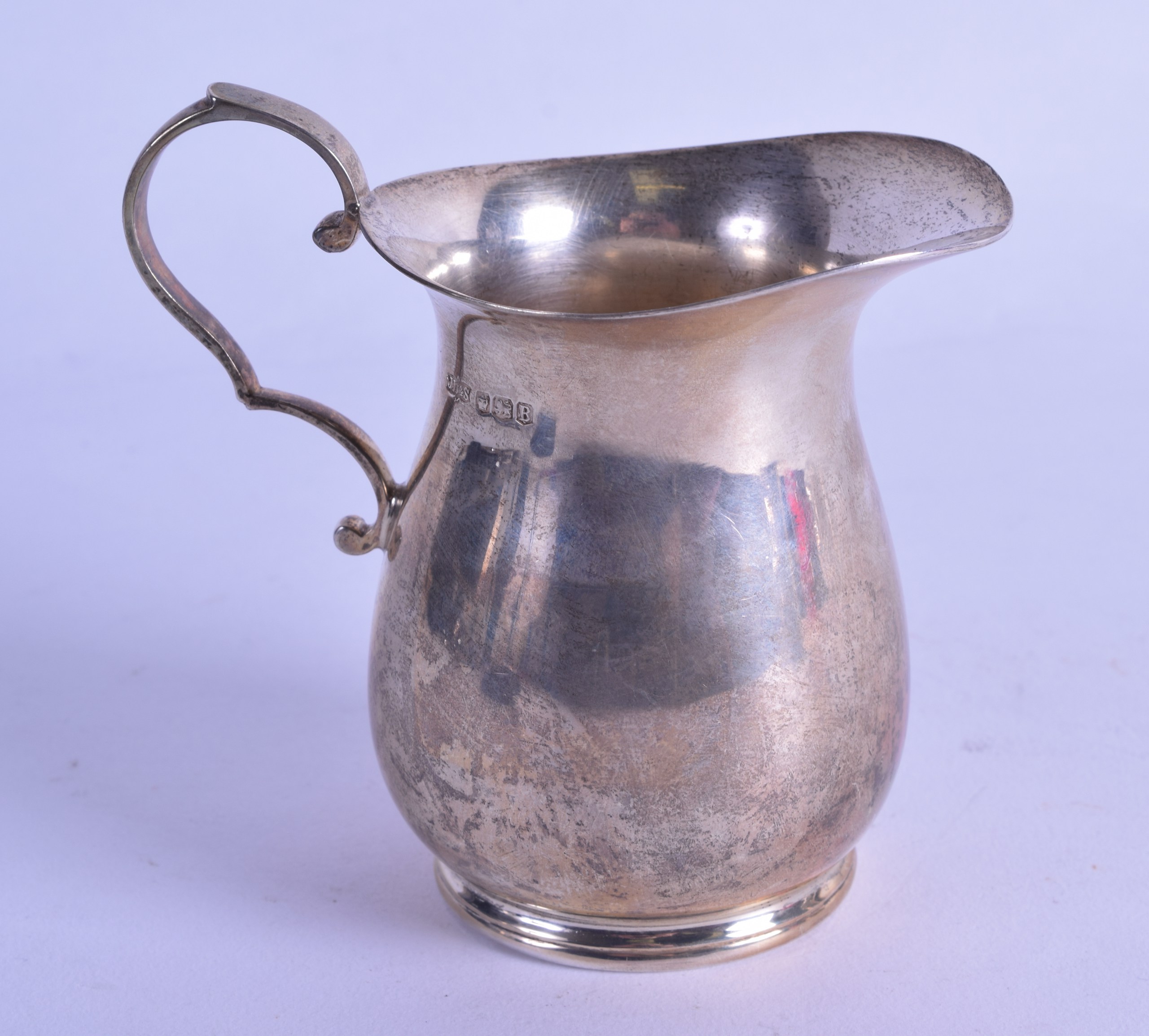 A SILVER CREAM JUG. Sheffield 1944. 4 oz.