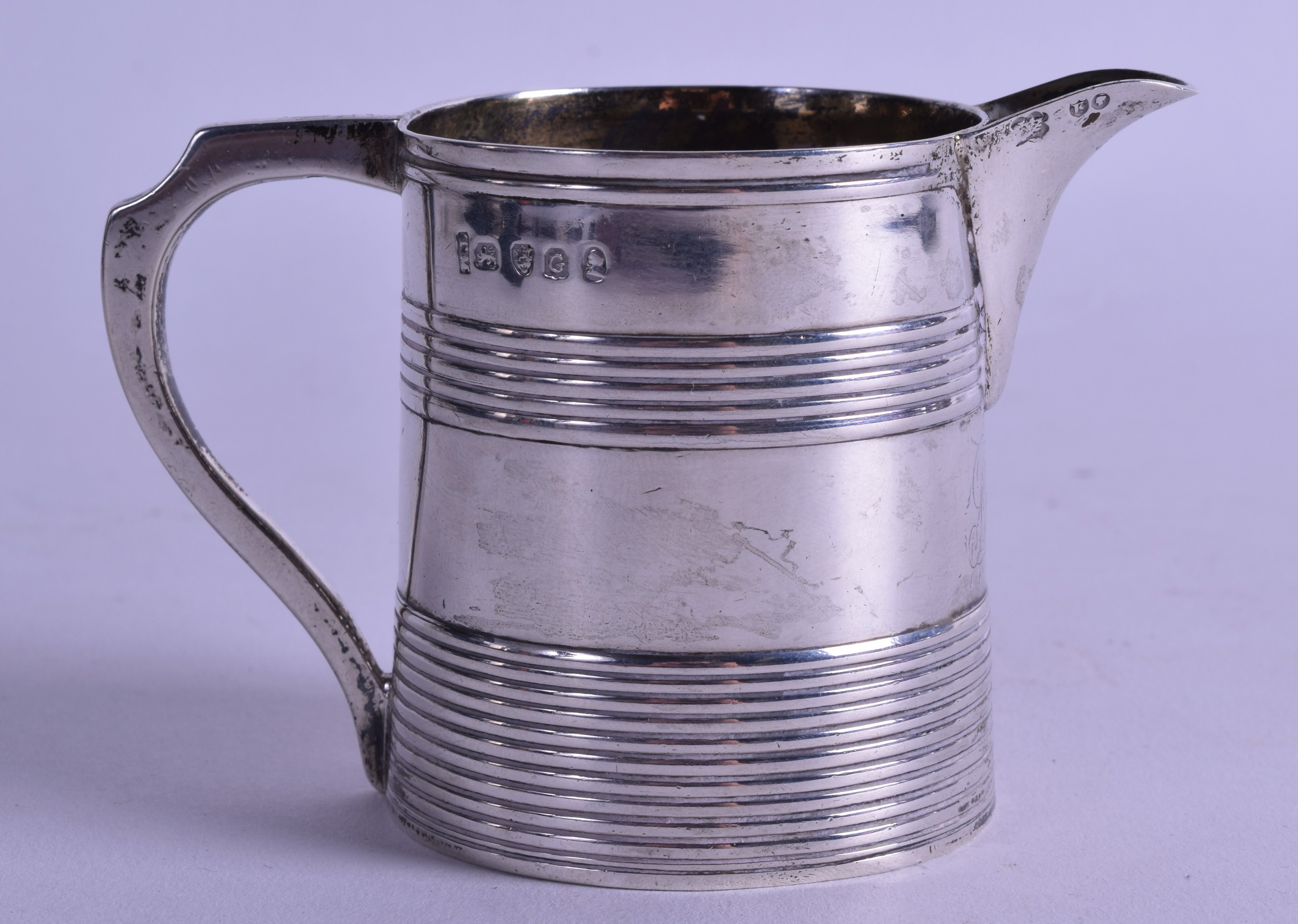 A SILVER CHRISTENING MUG converted to a milk jug. London 1802, altered spout 1885. 3.4 oz.