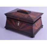 AN UNUSUAL MID 19TH CENTURY WALNUT AND ROSEWOOD TEA CADDY AND COVER decorated with sun burst motifs,