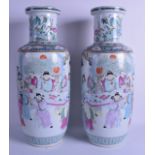 A GOOD PAIR OF 19TH CENTURY CHINESE FAMILLE ROSE ROULEAU VASES Guangxu, painted with scholars within