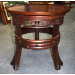 A 19TH CENTURY CHINESE CARVED HARDWOOD CIRCULAR TABLE. 51 cm x 53 cm.