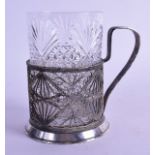 A LATE 19TH CENTURY RUSSIAN FILIGREE TEA GLASS HOLDER with glass. 10.5 cm high.