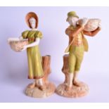 Royal Worcester fine pair of shot enamel figures of a young man and woman carrying baskets, shape