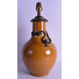 AN UNUSUAL 19TH CENTURY CHINESE YELLOW GLAZED VASE converted to a lamp, bearing Qianlong marks to