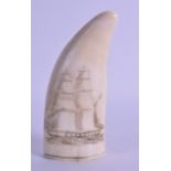 A 19TH CENTURY CARVED IVORY SCRIMSHAW TOOTH engraved with a boat in full sail at sea. 13.5 cm