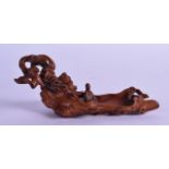 A FINE CHINESE QING DYNASTY CARVED BOXWOOD BRUSH WASHER in the form of a seated Guanyin upon a