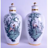 A FINE AND RARE PAIR OF 19TH CENTURY MEISSEN PORCELAIN VASES AND COVERS painted with lovers upon a