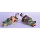 AN UNUSUAL PAIR OF CHINESE REPUBLICAN PERIOD RECLINING FIGURES modelled smoking opium. 16 cm wide.