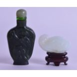 A CHINESE QING DYNASTY CARVED WHITE JADE FIGURE OF A RECUMBANT BIRD together with a spinach jade