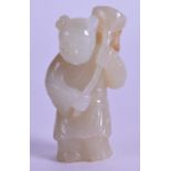 A CHINESE CARVED GREEN JADE FIGURE OF A YOUNG BOY modelled holding a floral sprig. 5.25 cm high.