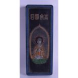 AN UNUSUAL CHINESE CARVED BLACK INKBLOCK decorated with a seated buddha, the reverse with