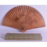 AN EARLY 20TH CENTURY CHINESE CARVED SANDALWOOD FAN painted with birds beside flowering rock. 42