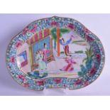 A MID 19TH CENTURY CHINESE FAMILLE ROSE LOBED DISH painted with two figures performing to a male and