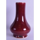 A CHINESE SANG DU BOEUF BALUSTER VASE with open work foot. 21.5 cm high. Good, firing crack to rim