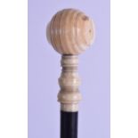 A MID 19TH CENTURY CARVED LONG HANDLED IVORY HAMMER with ebonised shaft. 40 cm long. Natural flaws