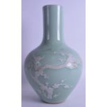 A CHINESE QING DYNASTY CELADON BULBOUS VASE Kangxi style, overlaid with white enamelled birds and