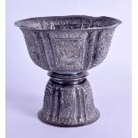 A GOOD 19TH CENTURY TIBETAN SILVER OFFERING CUP decorated in relief with buddhistic lions and