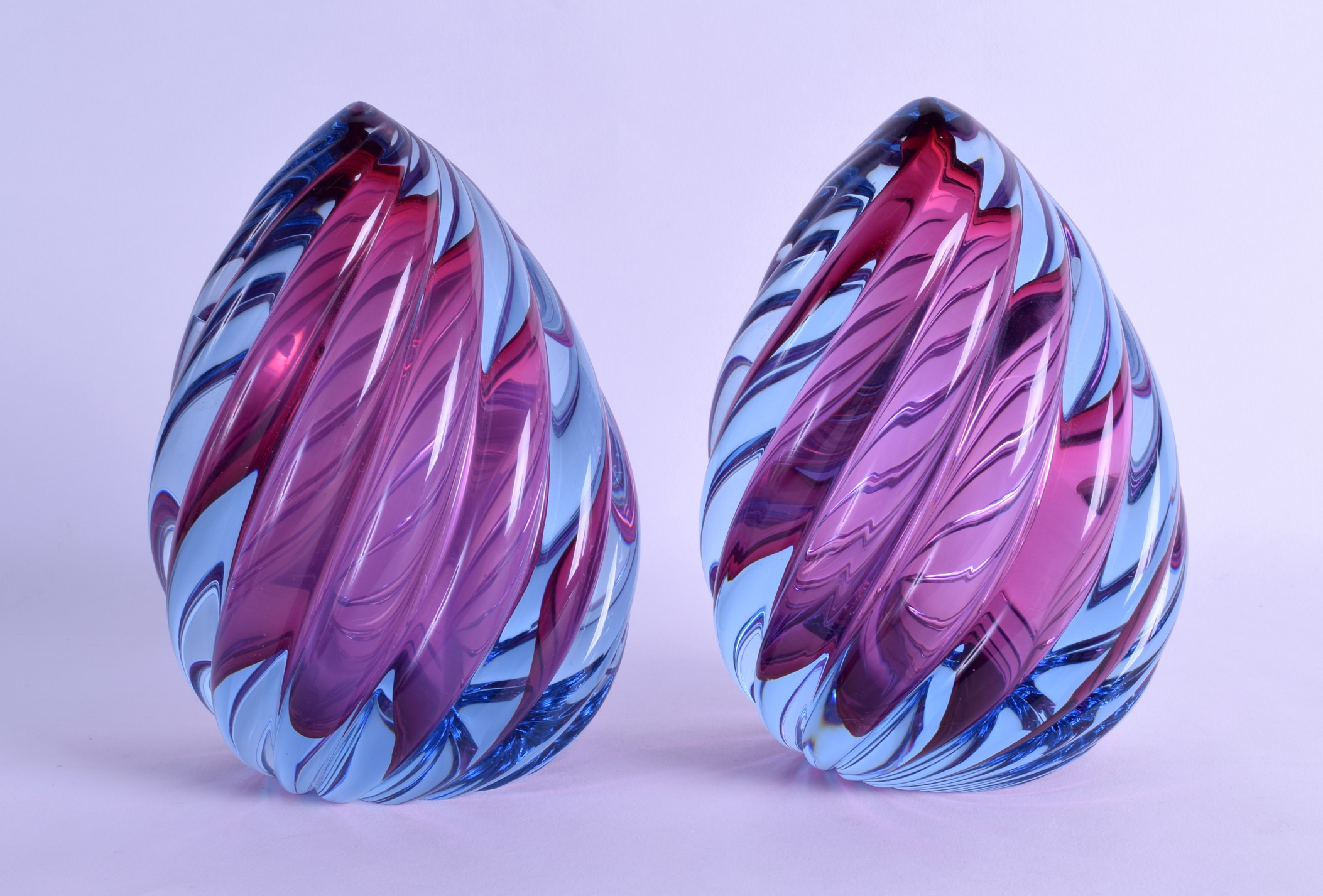 A STYLISH PAIR OF MURANO STYLE PUCE AND BLUE GLASS SCULPTURES. 17.5 cm high.