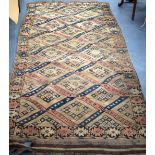 AN ANTIQUE BEIGE GROUND PERSIAN RUG, decorated with symbols. 236 cm x 114 cm.