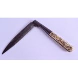 A RARE EARLY 19TH CENTURY CARVED AND ENGRAVED BONE AND STEEL CUT THROAT RAZOR by Vauzy. 29 cm long.