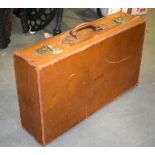 A VINTAGE LEATHER SUITCASE. 38 cm x 65 cm.