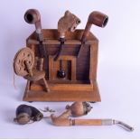 A 1920S CARVED GERMAN OAK NOVELTY PIPE HOLDER in the form of a mantle piece, together with five