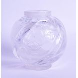 AN ISLAMIC HEAVY GLASS VASE engraved with flowers. 8.25 cm high.