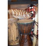 TWO AFRICAN DRUMS, together with shield etc. (5)