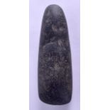 A NEOLITHIC CARVED AXE HEAD. 16 cm long.
