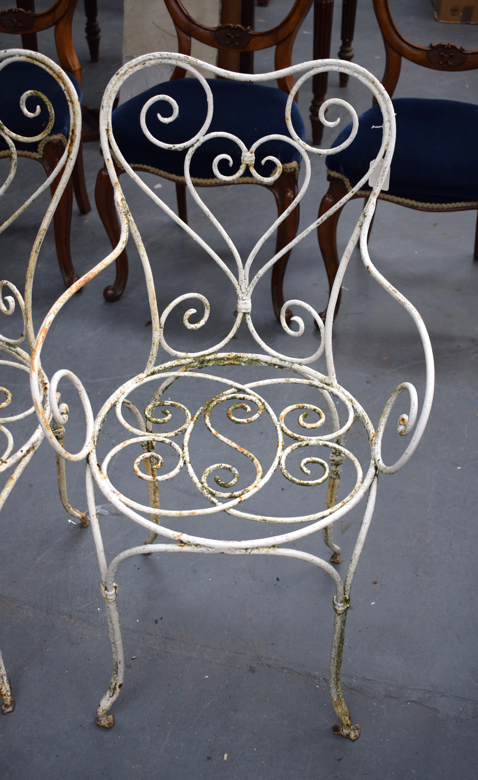 A SET OF FOUR CAST IRON CHAIRS, painted white. (4) - Image 2 of 2