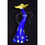 A STYLISH ABSTRACT GLASS CULPTURE, formed as a female wearing a hat. 24 cm high.