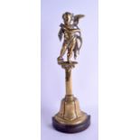 AN 18TH/19TH CENTURY CONTINENTAL BRONZE AND IRON DOOR STOP in the form of a standing putti. 41 cm