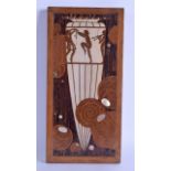 AN ART DECO CARVED WOOD IVORY AND MOTHER OF PEARL PANEL depicting stylish figures dancing within