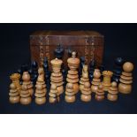 A VINTAGE CHESS SET, in an antique inlaid box. King hieghy 10.5 cm.